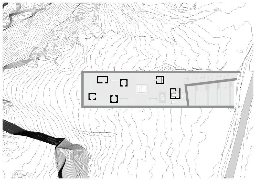 Site plan and layout diagram for Ionad Hiort Visitor Centre by Dualchas Architects, showing a linear rectangular volume set into sloping topography.