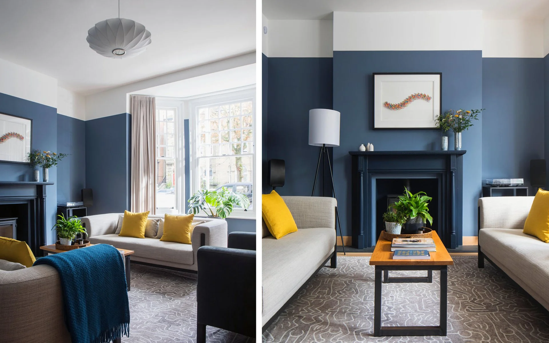Living room interior featuring dark blue lower walls, white upper walls, a bay window, and a dark fireplace mantel by MortonScarr Architects.