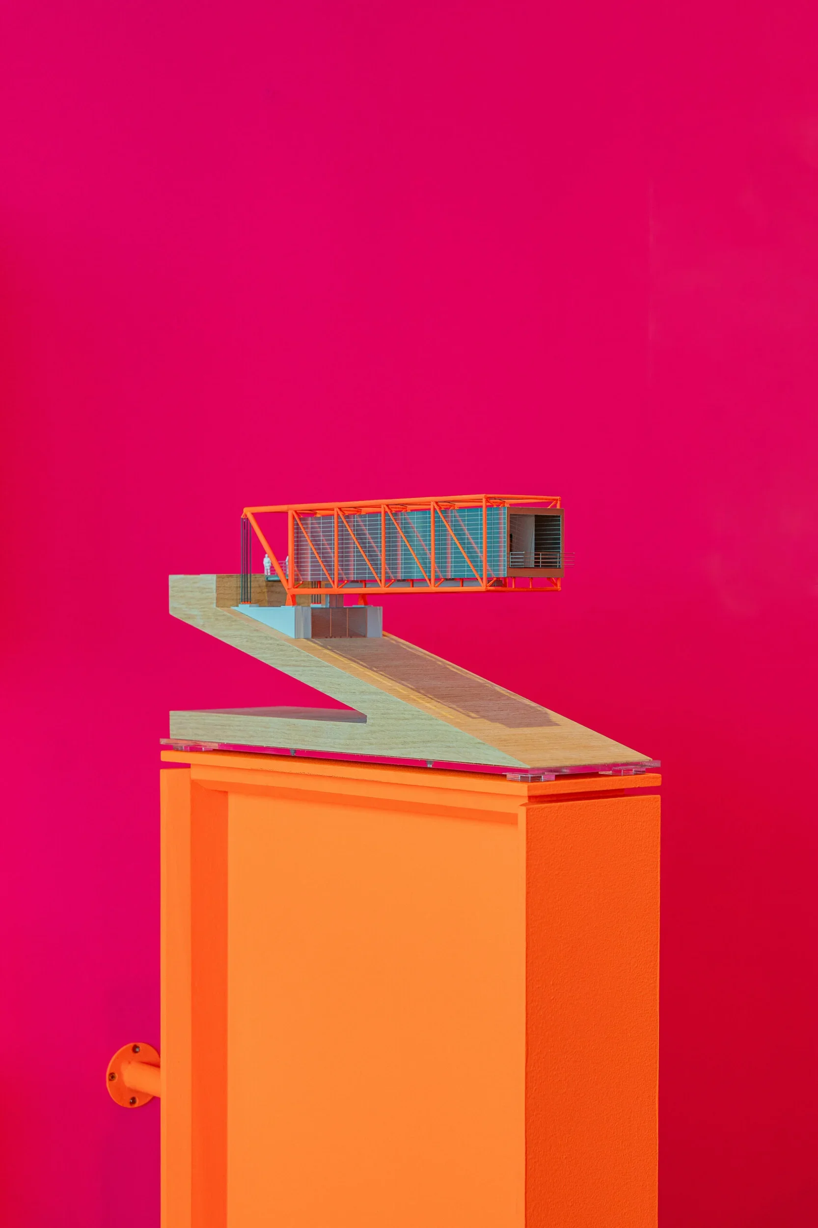 Physical architectural model of a cantilevered truss volume on a z-shaped timber base by Ab Rogers Design.