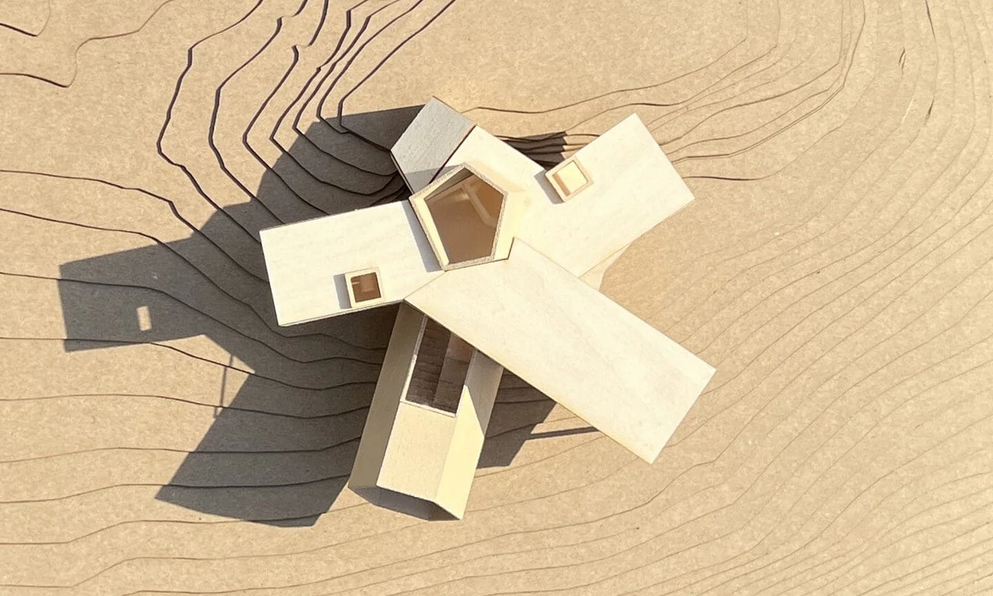 Physical architectural model of a branching house on a layered topographic site by Steven Holl Architects.