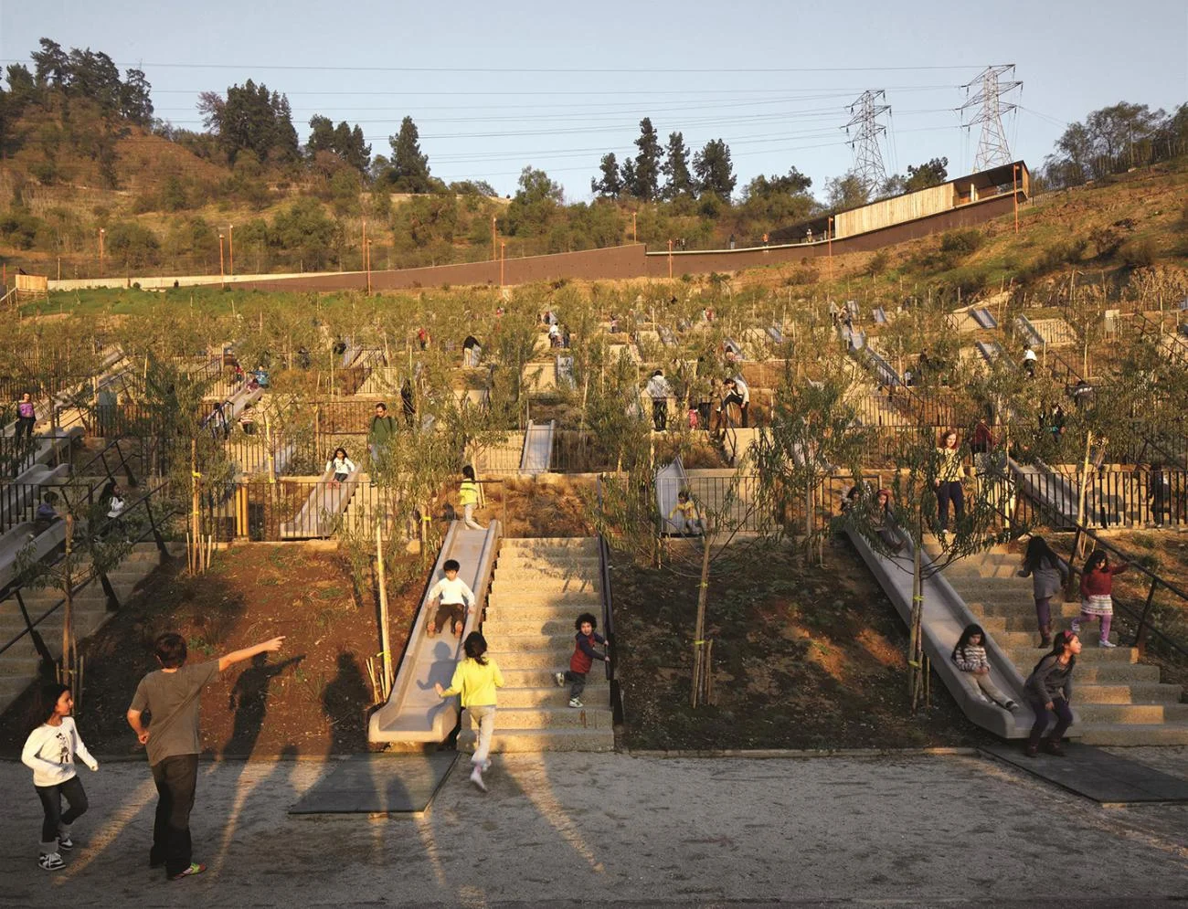 Bicentennial Children's Park in Santiago by Alejandro Aravena, featuring a terraced hillside with concrete slides.