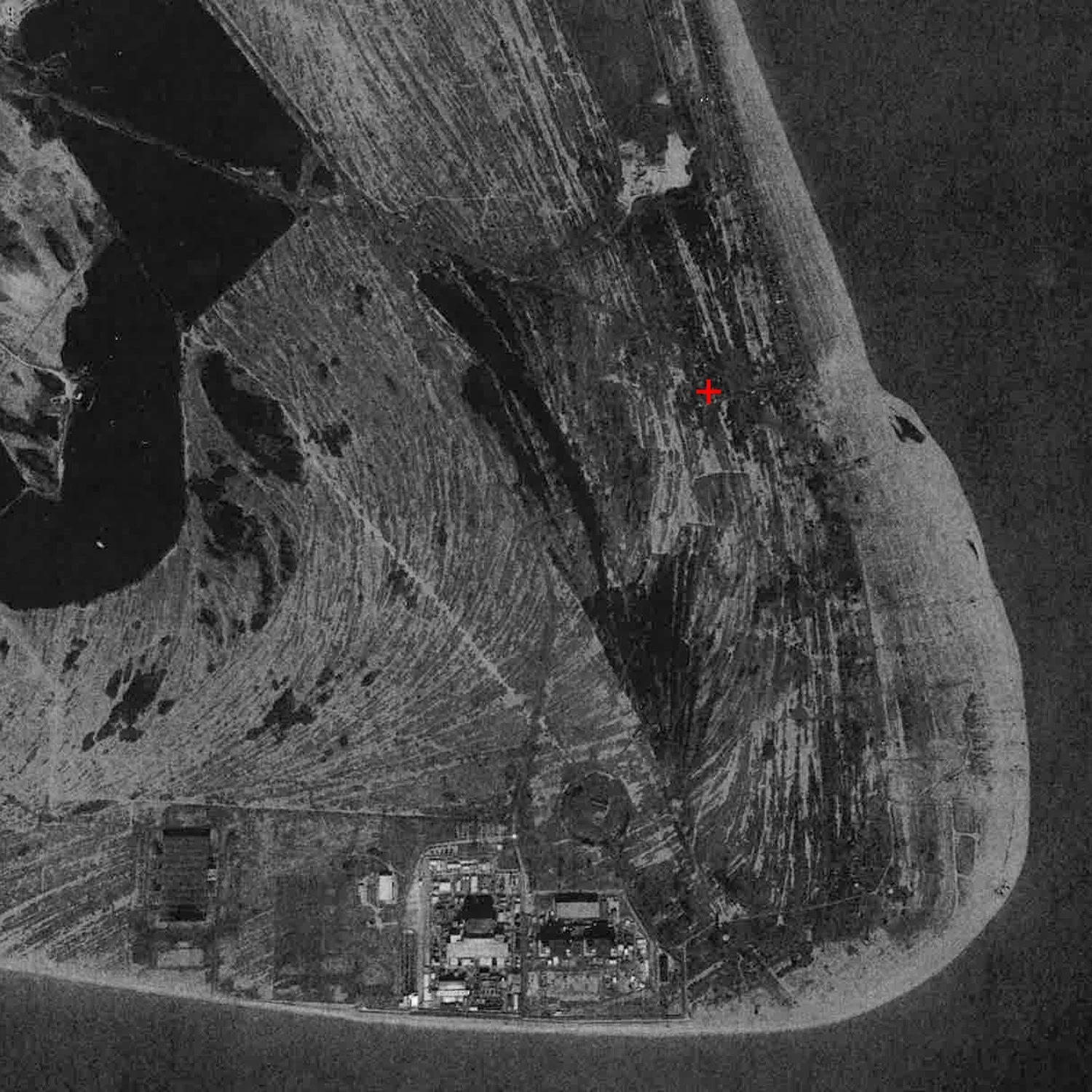 Aerial site map with topographical line work and a red marker by Adam Khan Architects.