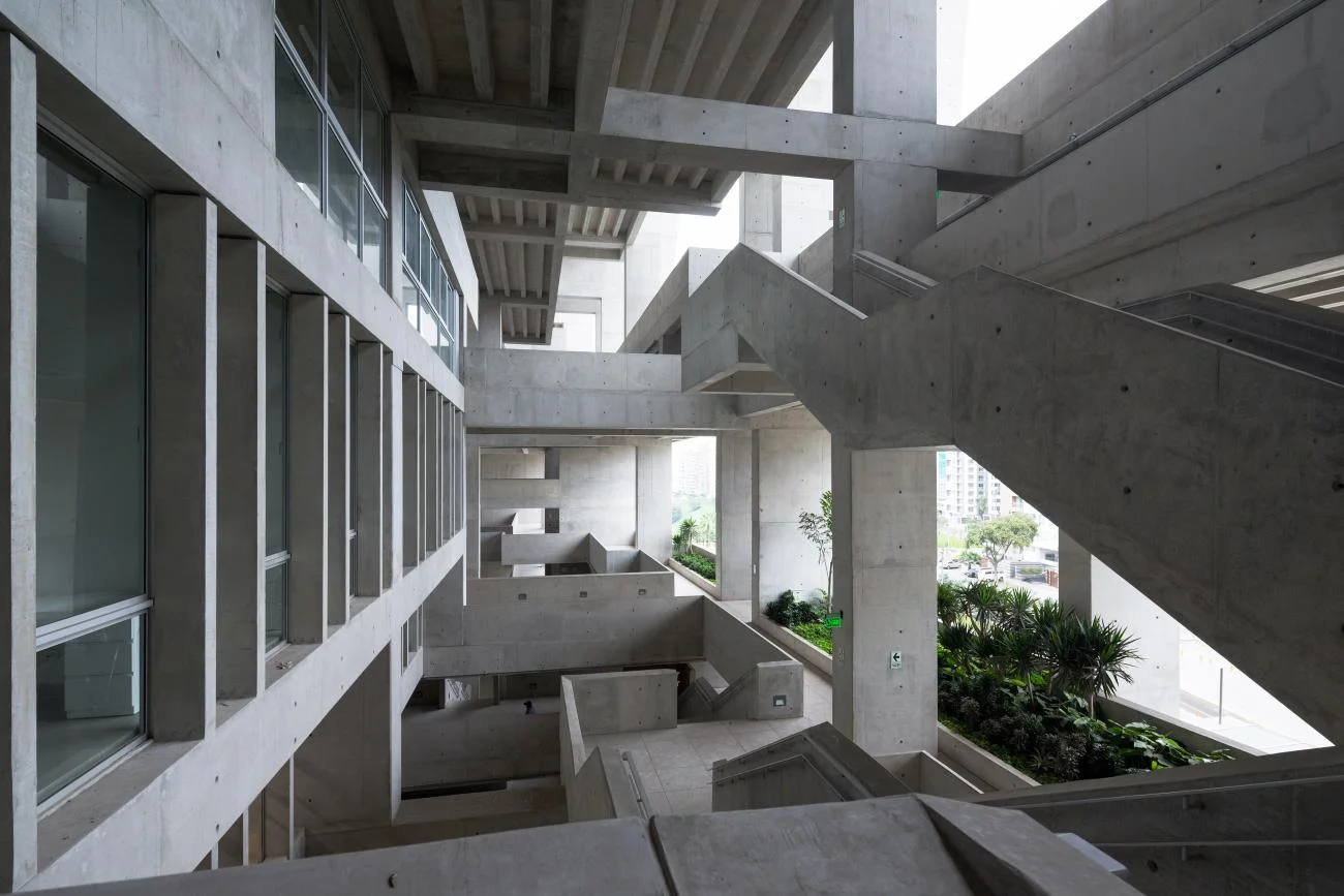 Exposed concrete structural frame and open-air staircases at UTEC Lima by Yvonne Farrell and Shelley McNamara.