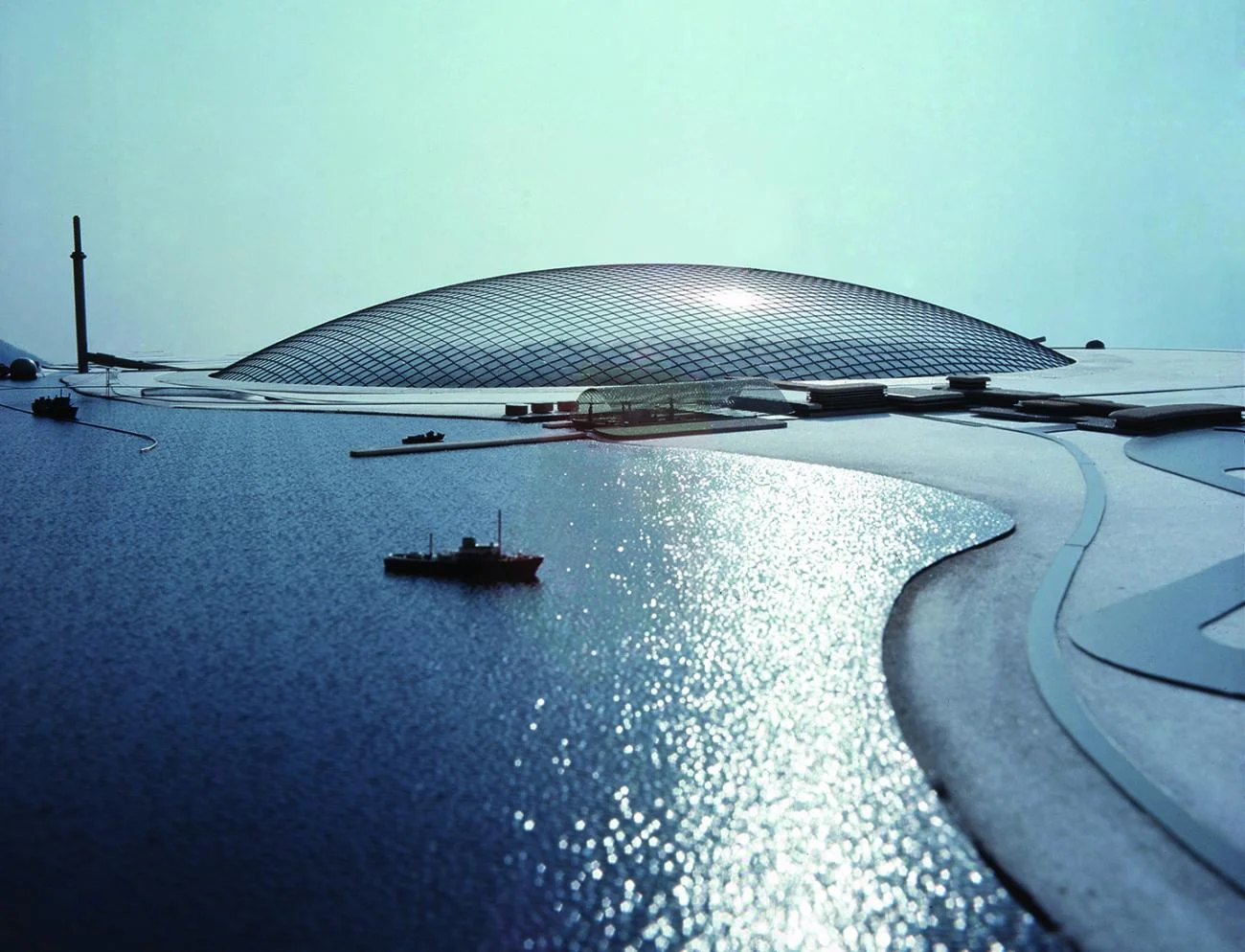 Physical model of Frei Otto's City in the Arctic showing a massive glass-like dome over a harbor.