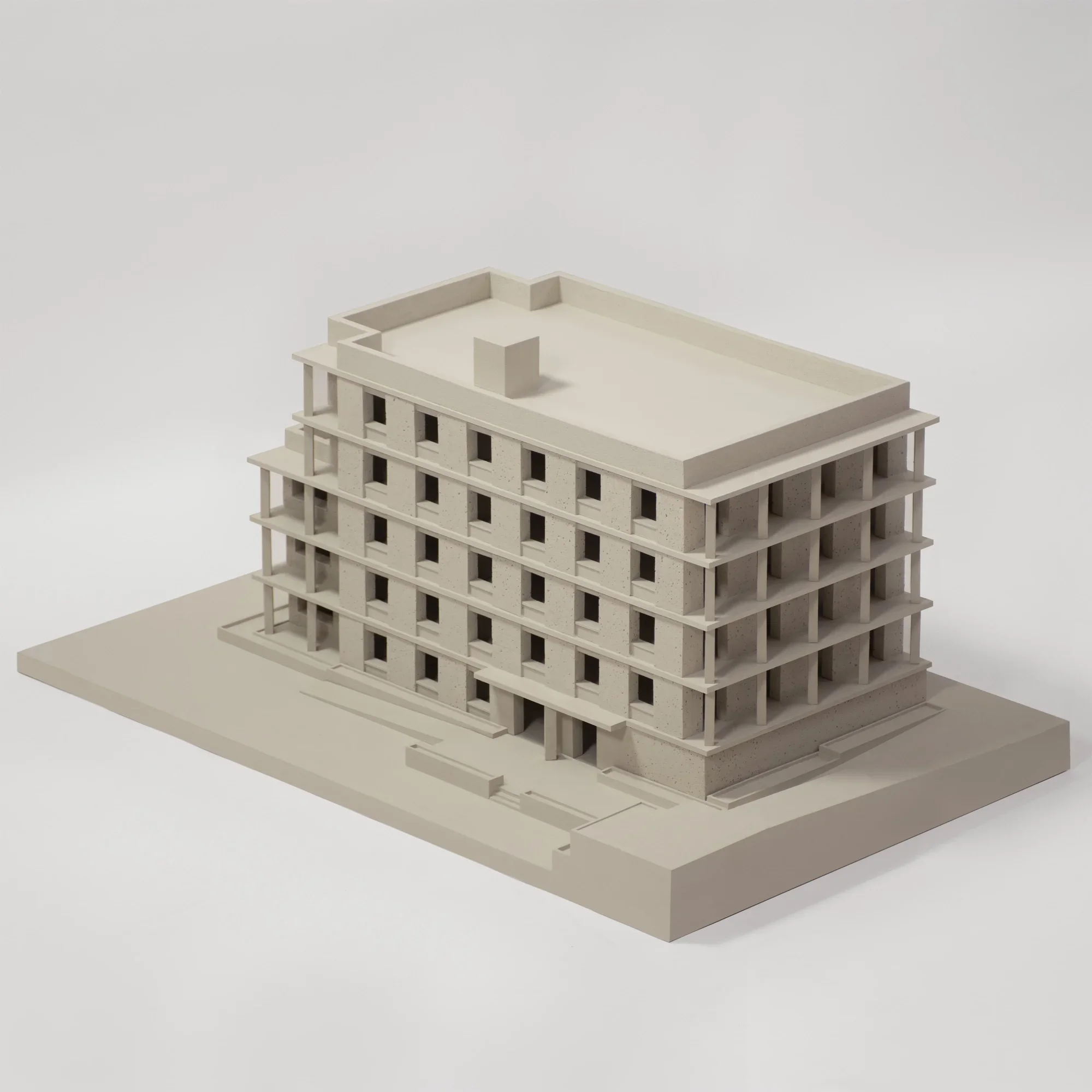 Physical architectural massing model of a multi-story building with a colonnade and punched windows by Al-Jawad Pike.