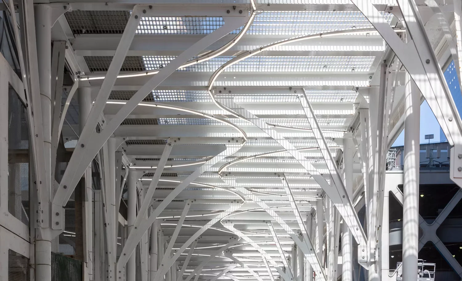Detailed view of the Urban Umbrella white steel structural canopy framing and grating roof by AGENCIE.