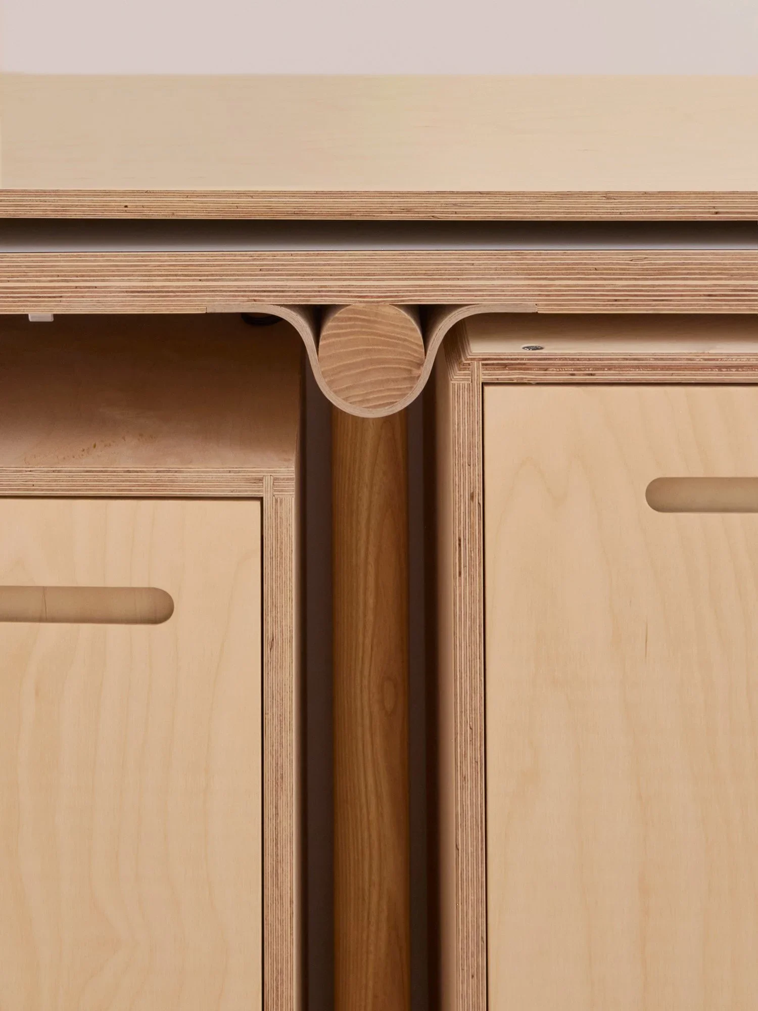 Close-up detail of bent plywood cabinetry and joinery by Lozi Designs.