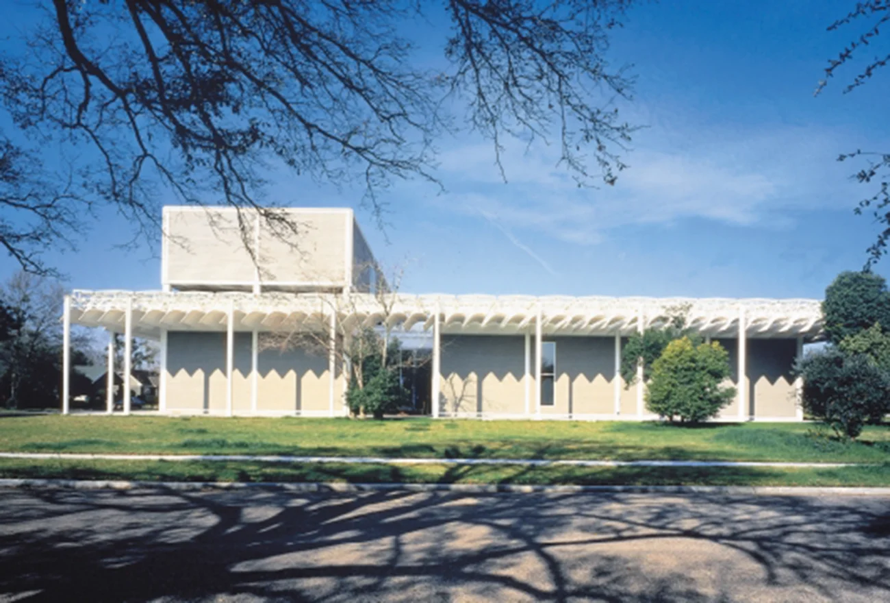 Exterior facade of the Menil Collection Museum in Houston by Renzo Piano, showing its iconic louvered canopy.