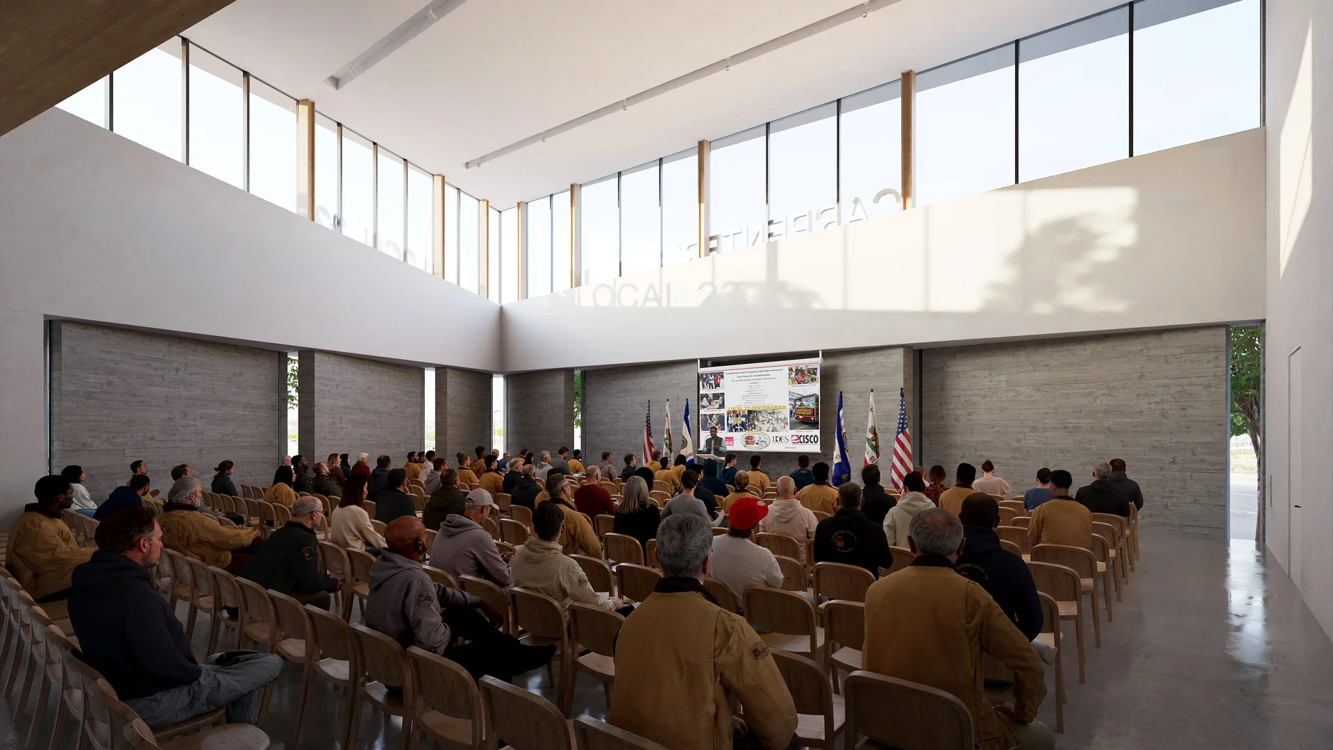Interior view of a double-height assembly hall by Mithun featuring board-formed concrete walls, continuous clerestory windows, and rows of wood chairs.