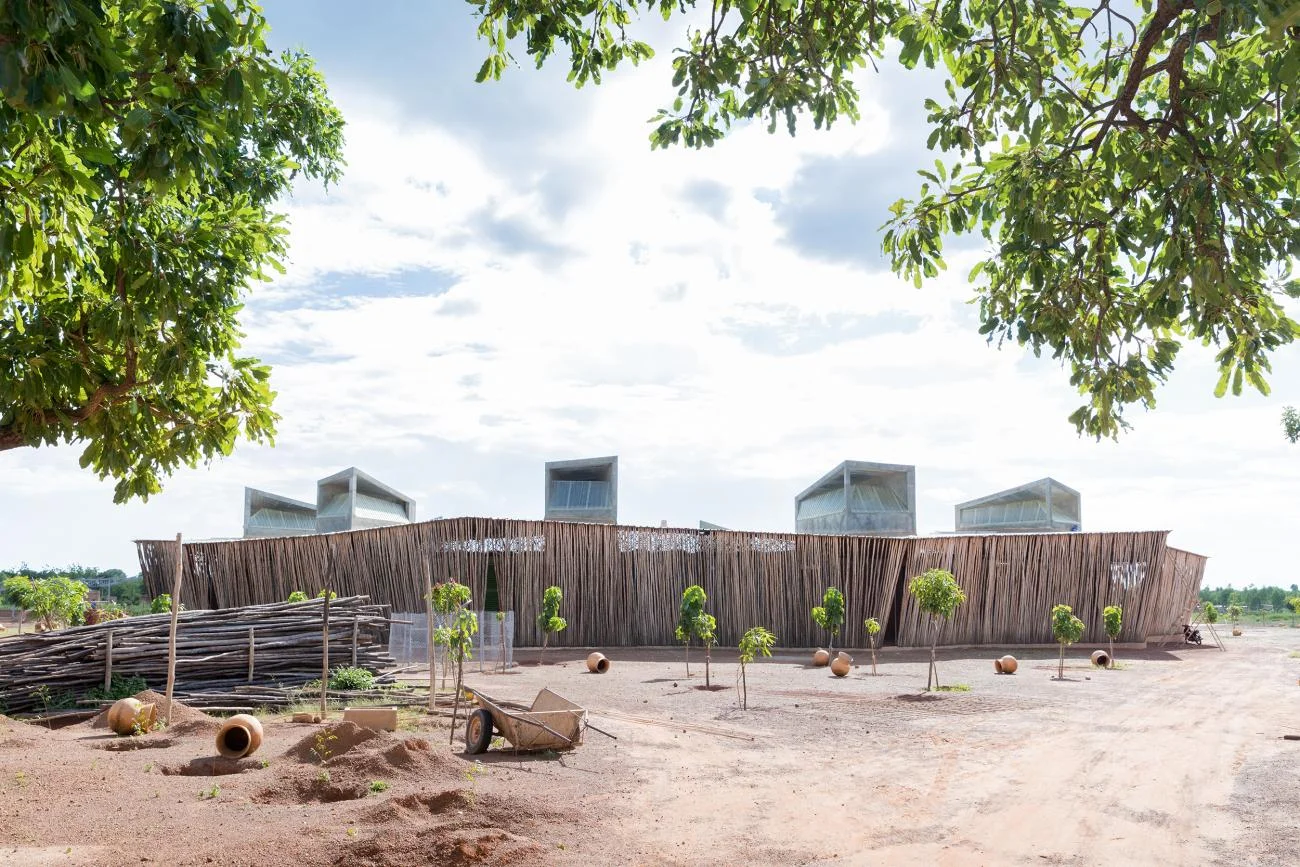 Lycée Schorge Secondary School by Francis Kéré, featuring a circular eucalyptus screen and concrete wind towers.