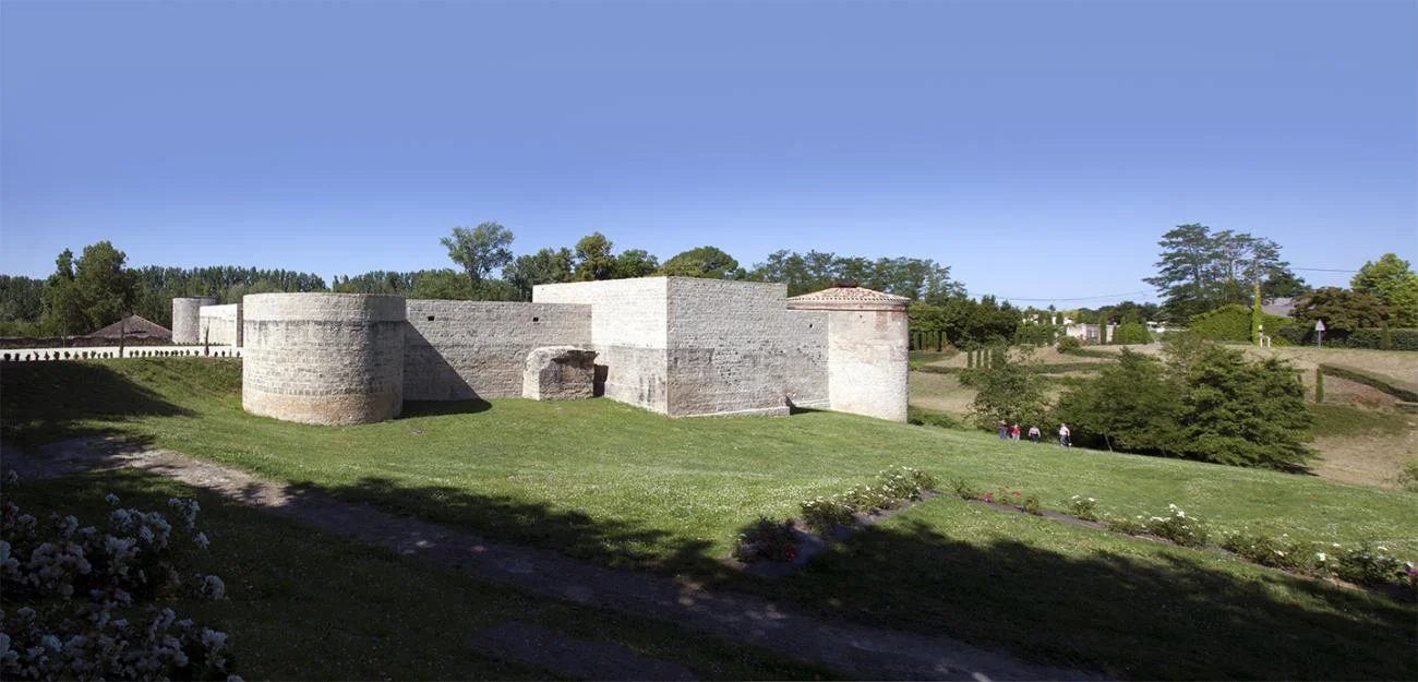 Historic stone castle walls and bastions of La Cuisine Art Center in Nègrepelisse, France.